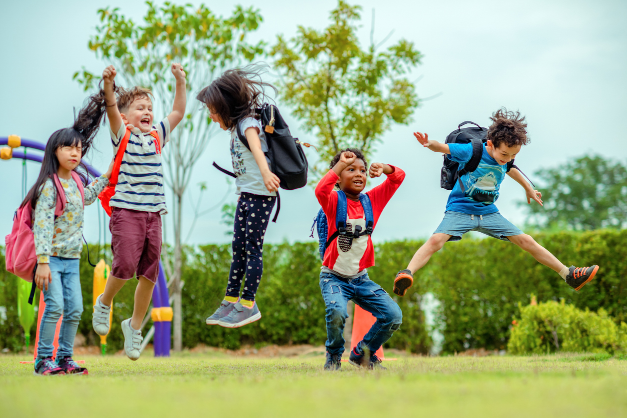 Kids jumping outdoors